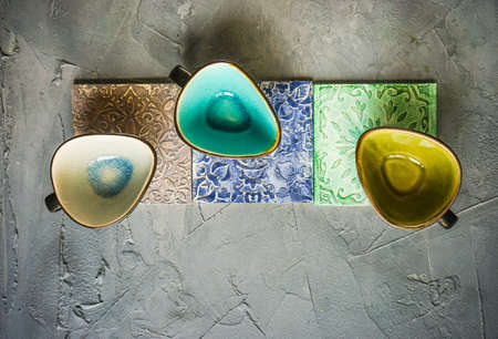 Drink set on mat in moorish style on grey concrete background with copy space