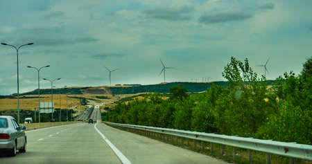 Georgia, JULY 6 2018: E60 highway the main road to western Georgia and Turkey and Winf Wheels close to Gori townのeditorial素材