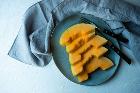 Summer fruit dessert with melon  on rustic background with copy space