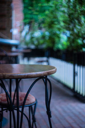 Coffee table with glass of coffee on cafe balconyの写真素材