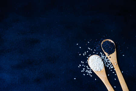 Variety of sesame seeds on blackboard with copy spaceの写真素材