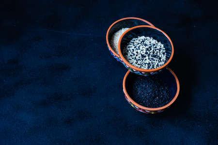 Variety of sesame seeds on blackboard with copy spaceの写真素材