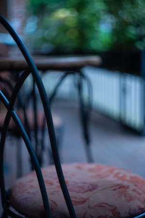 Coffee table with glass of coffee on cafe balconyの写真素材