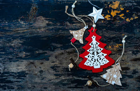 Christmas frame with wooden decor on old dark wooden background with copy space