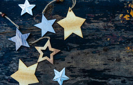 Christmas frame with wooden decor on old dark wooden background with copy space