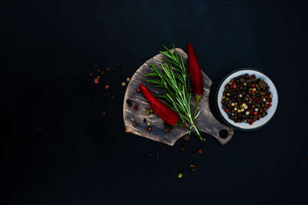 Organic food cooking concept with fresh spices on dark background with copyspaceの写真素材