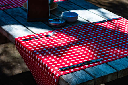 Garden party served table with cutlery in coutryside style