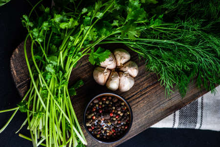 Ingredient for sour cream sauce with garlic, dill and spices on rustic background with copy spaceの写真素材