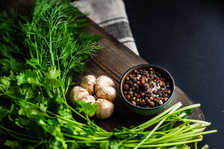 Ingredient for sour cream sauce with garlic, dill and spices on rustic background with copy spaceの写真素材
