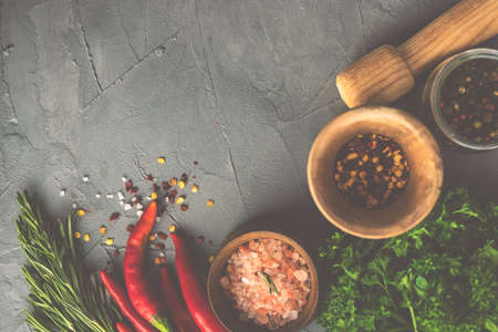 Organic spices and herbs  on rustic background with copy space