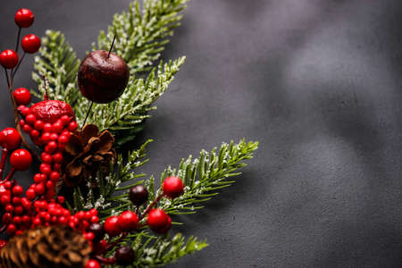 Christmas card concept on dark wooden background with copy space