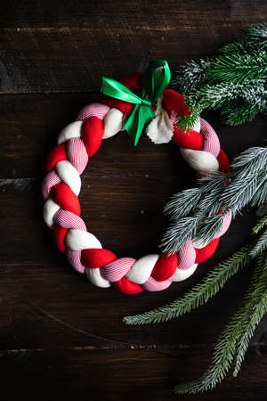 Christmas card concept with handmade decoration on dark wooden background with copy space