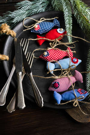Christmas card concept with handmade decoration on dark wooden background with copy spaceの写真素材