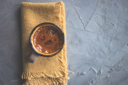 Vintage ceramic cup of hot spicy  chocolate with red pepper, selective focusの写真素材
