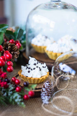 Christmas dessert concept with tartlet stuffed with cream and chocolateの写真素材