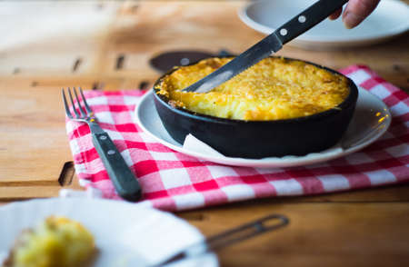 Irish potato pie on rustic table with copyspaceの写真素材