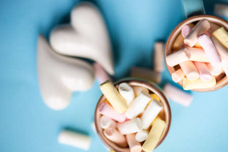 Sweet marshmallow and heart decor as sweet food concept on rustic background with copy spaceの写真素材