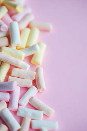 Sweet marshmallow as a food concept on rustic background with copy space