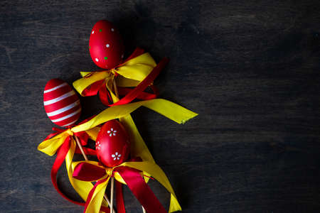 Easter card concept with eggs, nest and bunny on wooden background with copy space