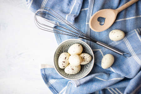 Cooking concept with eggs on white background with copy space