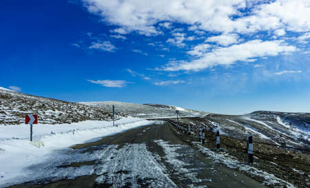 Blue winter sky and road in mountain, winter time in Caucasus mountain range close to Tbilisi,...