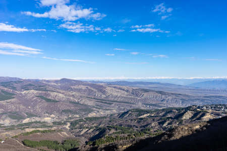 Blue winter sky and road in mountain, winter time in Caucasus mountain range close to Tbilisi,...