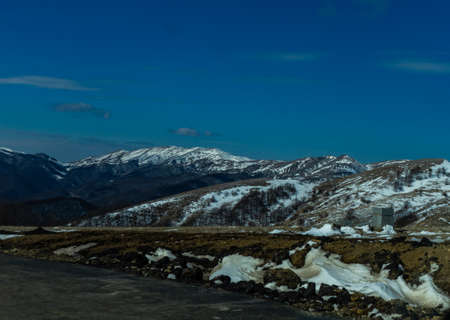 Blue winter sky and road in mountain, winter time in Caucasus mountain range close to Tbilisi,...