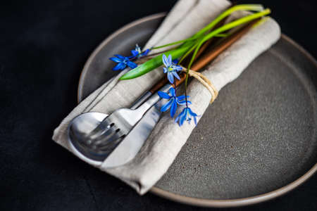 Spring table setting with blue scilla siberica flowers on concrete background with copy spaceの写真素材