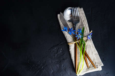 Spring table setting with blue scilla siberica flowers on concrete background with copy spaceの写真素材
