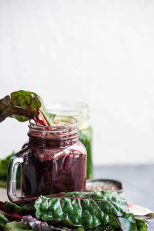 Organic vegetable smoothie with spinach and chia seeds on rustic background with copy spaceの写真素材