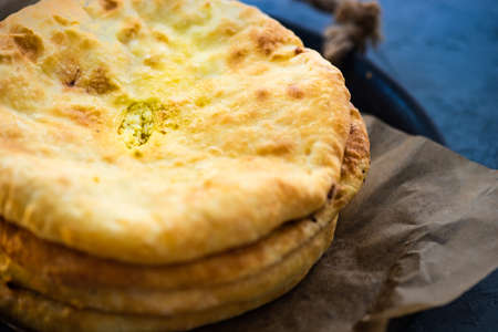 Traditional georgian cheese pie - imeruli khachapuri on rustic backgroundの写真素材