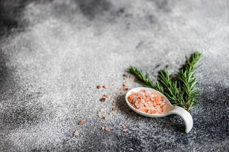 Spice cooking concept with sea salt and hot chilli pepper on dark background with copy spaceの写真素材
