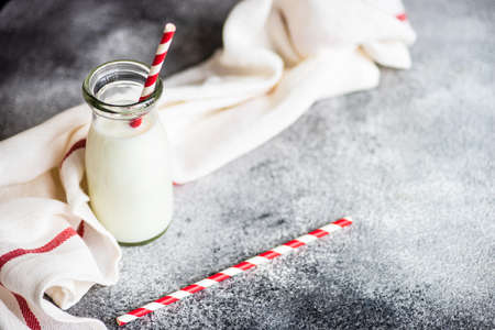 Vintage bottle of milk on grey background with copy spaceの写真素材