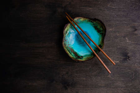 Asian table setting with chopsticks on wooden background with copy spaceの写真素材