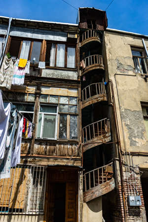 03 JUNE 2019, TBILISI, GEORGIA: Famous spiral stairs in inner yards of old houses in Old Tbilisi, Georgiaのeditorial素材