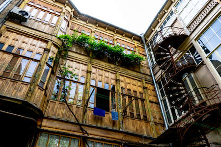 03 JUNE 2019, TBILISI, GEORGIA: Famous spiral stairs in inner yards of old houses in Old Tbilisi, Georgiaのeditorial素材