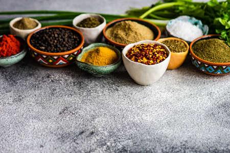 Frame with traditional georgian spices on rusty stone background with copy spaceの写真素材