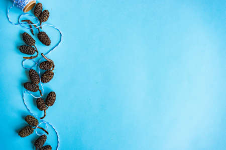 Christmas festive frame concept on blue background with copy spaceの写真素材