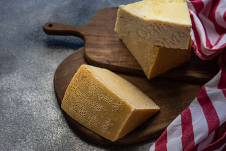 Italian cheese variety on cutting board with copy space