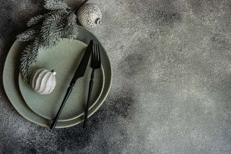 Rustic table setting for holiday Christmas dinner on grey stone background with copy spaceの写真素材
