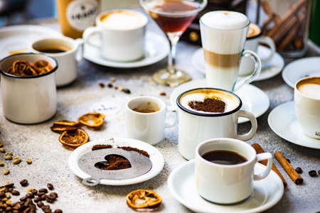 Coffee drink concept with variety of different coffee beverage on concrete background with copy...