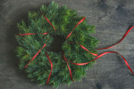 Christmas frame concept with fir tree on wooden vintage background with copy space