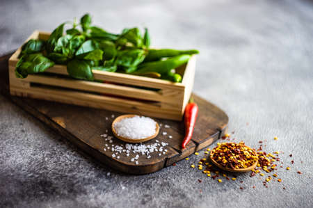 Cooking concept with hot chilli pepper on stone background with copy spaceの写真素材