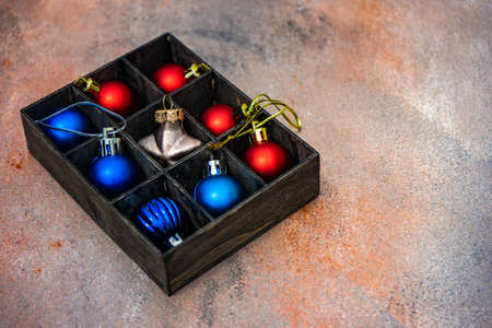 Christmas frame with xmas tree branches, balls and ribbon on concrete background with copy spaceの写真素材