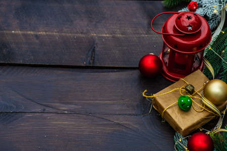 Christmas frame with xmas tree branches, balls and ribbon on concrete background with copy space