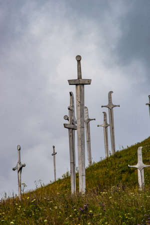 20 JULY 2019, GEORGIA, TBILISI, Famous Didgori battle monument with giant swards and sculptures of soldiers close to Tbilisi in Caucasus mountain rangeのeditorial素材