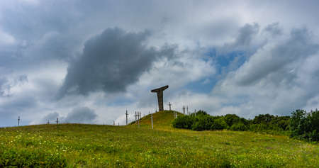 20 JULY 2019, GEORGIA, TBILISI, Famous Didgori battle monument with giant swards and sculptures of soldiers close to Tbilisi in Caucasus mountain rangeのeditorial素材