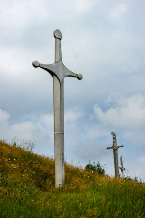 20 JULY 2019, GEORGIA, TBILISI, Famous Didgori battle monument with giant swards and sculptures of soldiers close to Tbilisi in Caucasus mountain rangeのeditorial素材