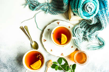 Mulled tea with lemon and spices on stone table with copy spaceの写真素材