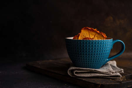 Traditional georgian dessert with dried persimmon fruits on dark concrete backgroundの写真素材